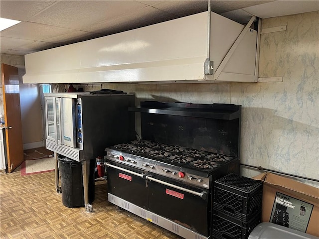 kitchen featuring a paneled ceiling