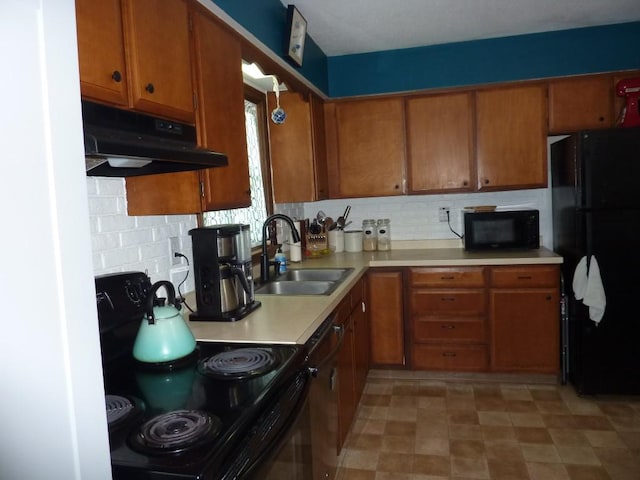 3404 Rustic Ln, Erie, PA 16506 - kitchen with black appliances, range hood, brown cabinets, light countertops, and backsplash