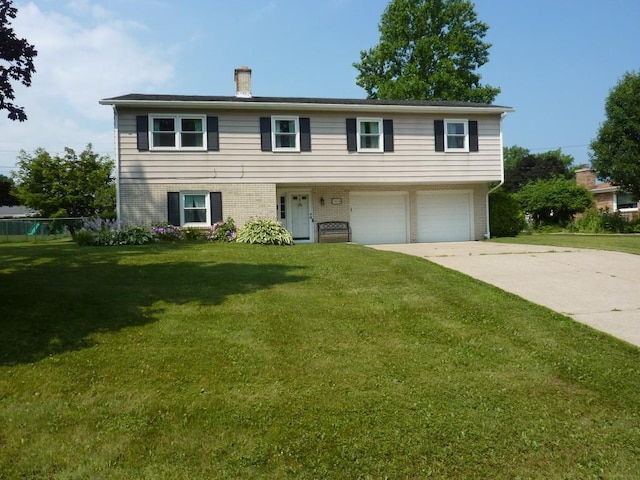 3404 Rustic Ln, Erie, PA 16506 - view of front of house featuring a garage, driveway, a front yard, a chimney, and brick siding
