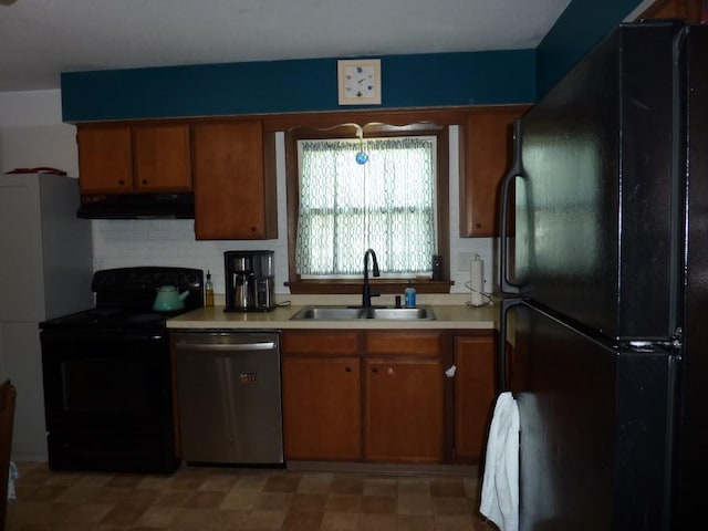 3404 Rustic Ln, Erie, PA 16506 - kitchen featuring black appliances, under cabinet range hood, light countertops, brown cabinets, and backsplash