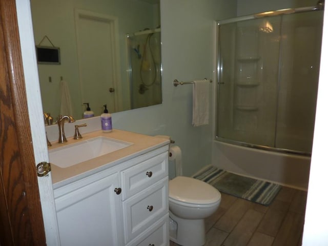 3404 Rustic Ln, Erie, PA 16506 - bathroom featuring vanity, enclosed tub / shower combo, and wood finished floors
