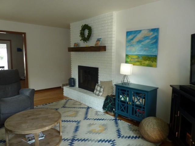 3404 Rustic Ln, Erie, PA 16506 - living area featuring wood finished floors and a fireplace