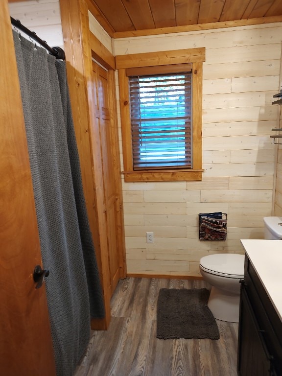 8766 Quaker Ln, Espyville, PA 16424 - full bathroom featuring wood walls, vanity, wood finished floors, a shower with shower curtain, and wooden ceiling