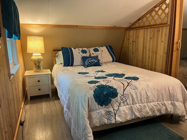 8766 Quaker Ln, Espyville, PA 16424 - bedroom with wood finished floors, lofted ceiling, and wood walls