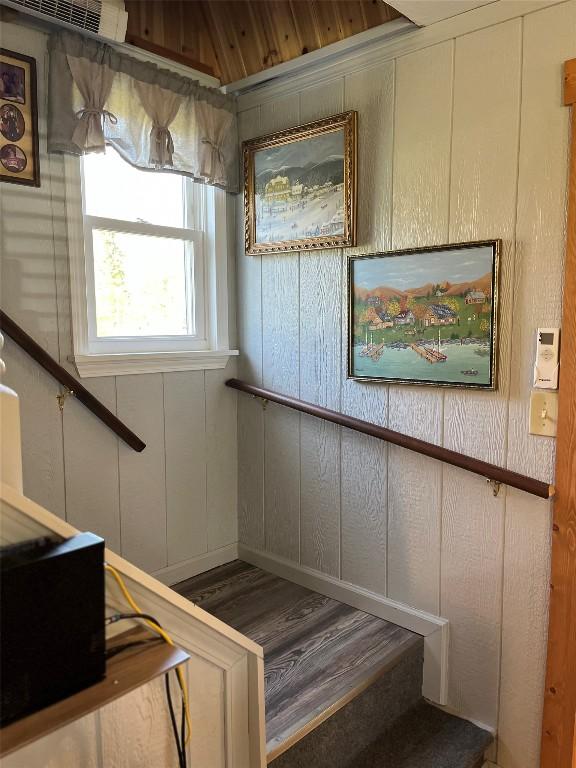 stairs featuring a decorative wall