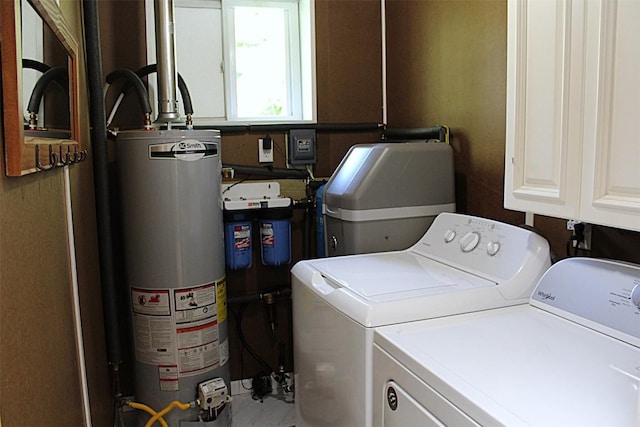 6361 Cherry Ext, Erie, PA 16509 - laundry room featuring gas water heater, washing machine and dryer, and cabinet space