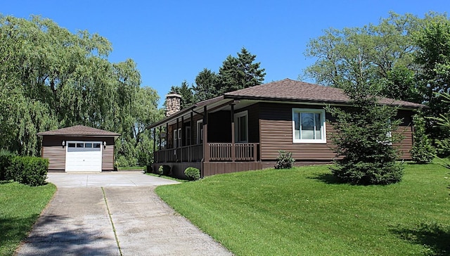 6361 Cherry Ext, Erie, PA 16509 - view of front of property with an outbuilding, concrete driveway, a garage, a front lawn, and a chimney