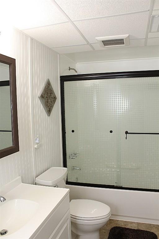 6361 Cherry Ext, Erie, PA 16509 - full bath featuring vanity, shower / bath combination with glass door, and tile patterned flooring