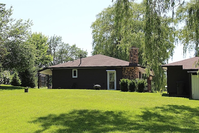 6361 Cherry Ext, Erie, PA 16509 - back of property featuring a chimney and a yard