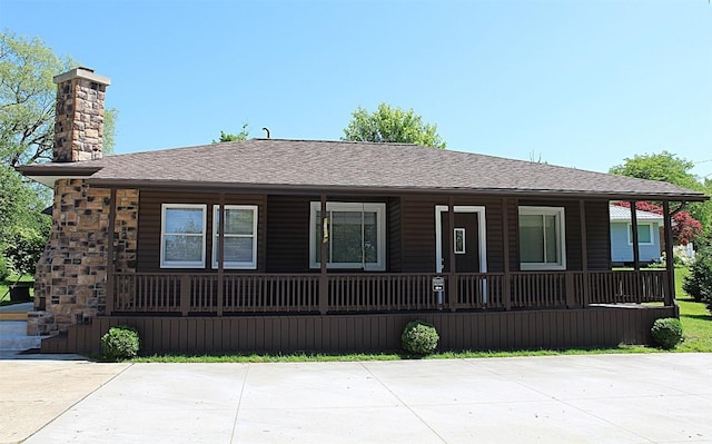 6361 Cherry Ext, Erie, PA 16509 - view of front of home featuring a porch, a chimney, and a shingled roof