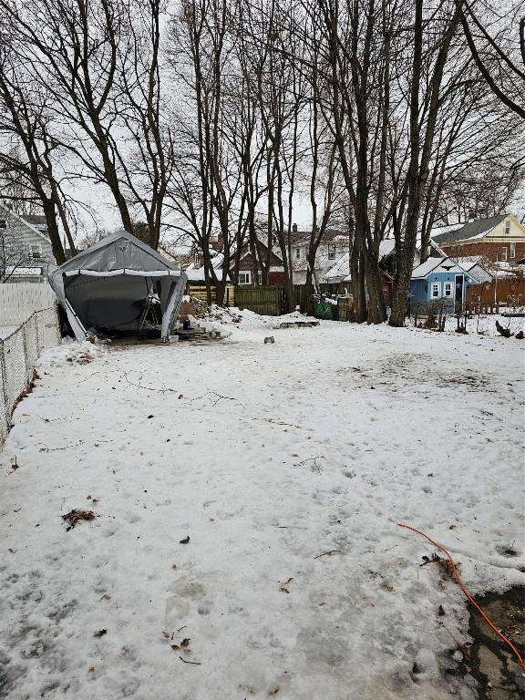 view of yard layered in snow