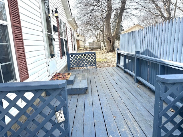 wooden deck featuring fence