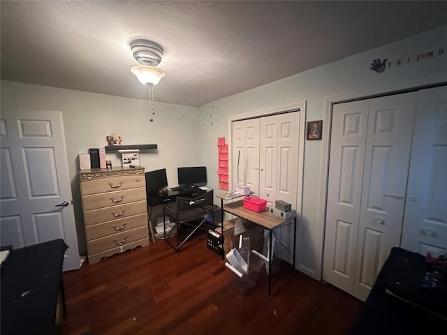 office space featuring dark wood-type flooring