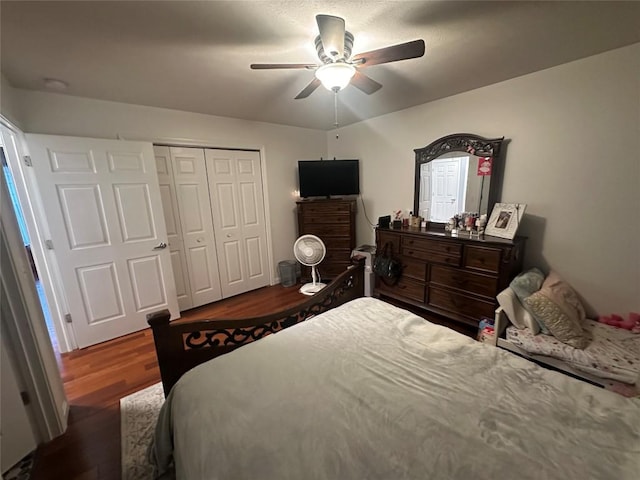 bedroom featuring a closet, ceiling fan, and wood finished floors