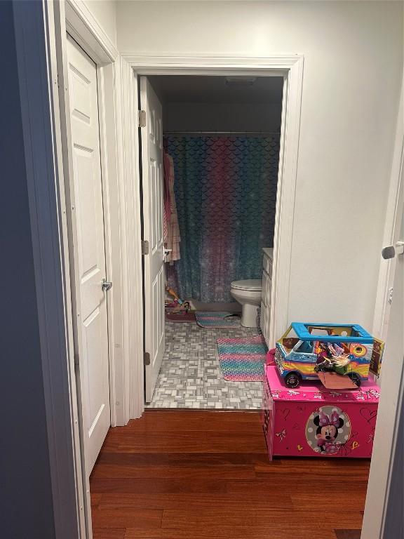 hallway featuring wood finished floors