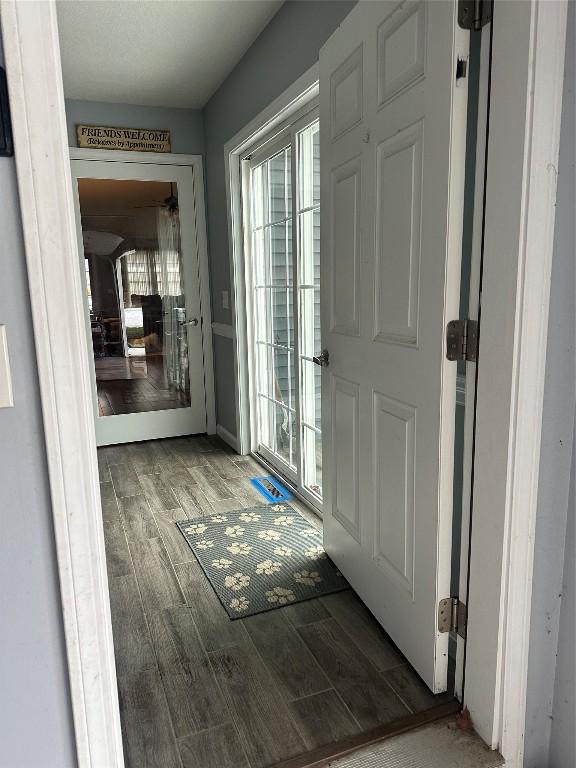 doorway to outside featuring wood tiled floor