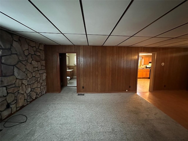 basement featuring light carpet