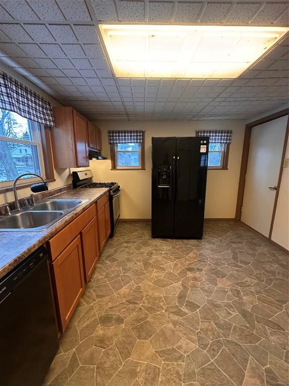 kitchen featuring sink and black appliances