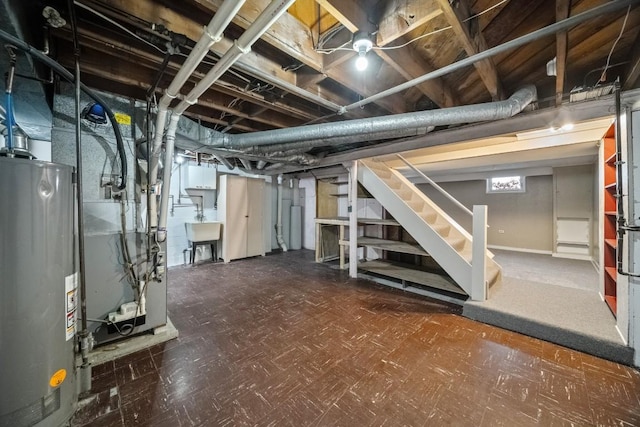 basement with sink and gas water heater