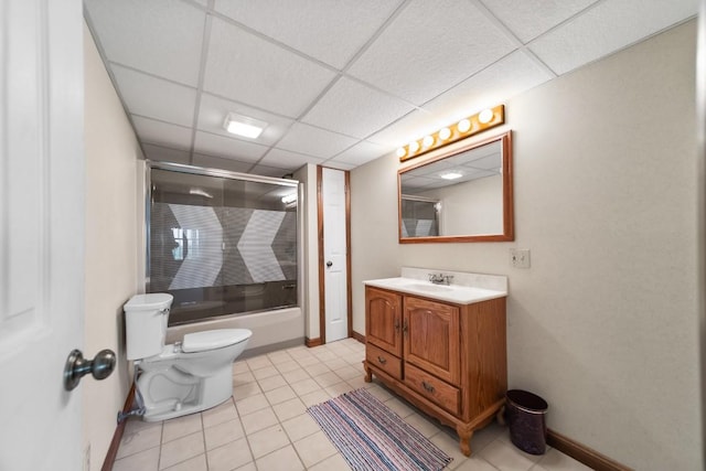 100 Fox Hollow Ln, Harborcreek, PA 16511 - bathroom featuring toilet, a paneled ceiling, vanity, bath / shower combo with glass door, and baseboards