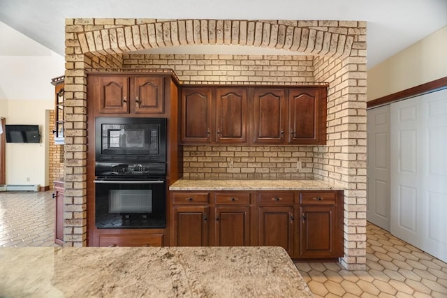 100 Fox Hollow Ln, Harborcreek, PA 16511 - kitchen featuring black appliances, light stone countertops, light tile patterned floors, and a baseboard radiator
