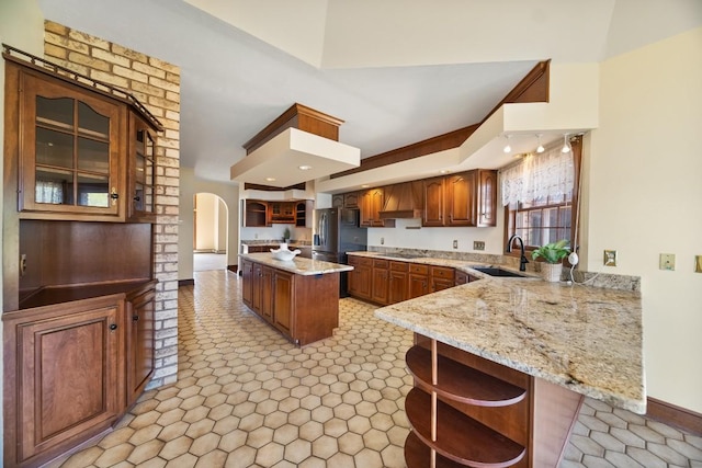 100 Fox Hollow Ln, Harborcreek, PA 16511 - kitchen featuring a sink, black appliances, open shelves, arched walkways, and premium range hood