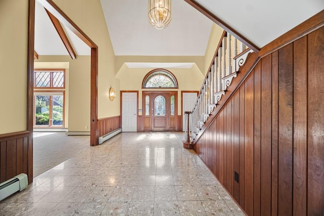 100 Fox Hollow Ln, Harborcreek, PA 16511 - entrance foyer featuring wainscoting, a chandelier, a baseboard radiator, high vaulted ceiling, and stairs