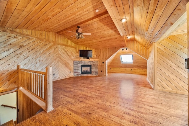 100 Fox Hollow Ln, Harborcreek, PA 16511 - additional living space with wood ceiling, wood walls, wood finished floors, a ceiling fan, and a fireplace