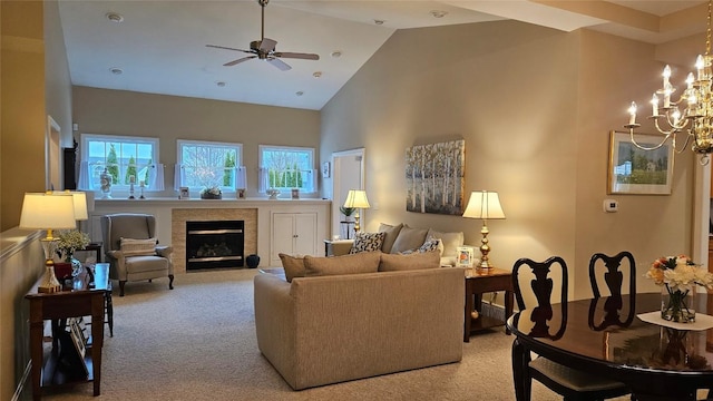 6007 Marble Ln, Fairview, PA 16415 - living area featuring light colored carpet, high vaulted ceiling, ceiling fan, a chandelier, and a glass covered fireplace
