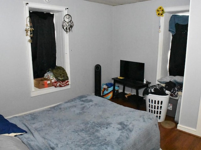 bedroom featuring wood finished floors