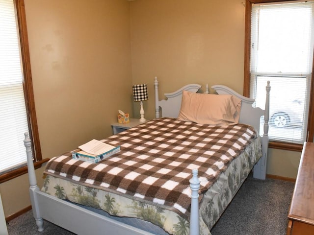 carpeted bedroom with baseboards