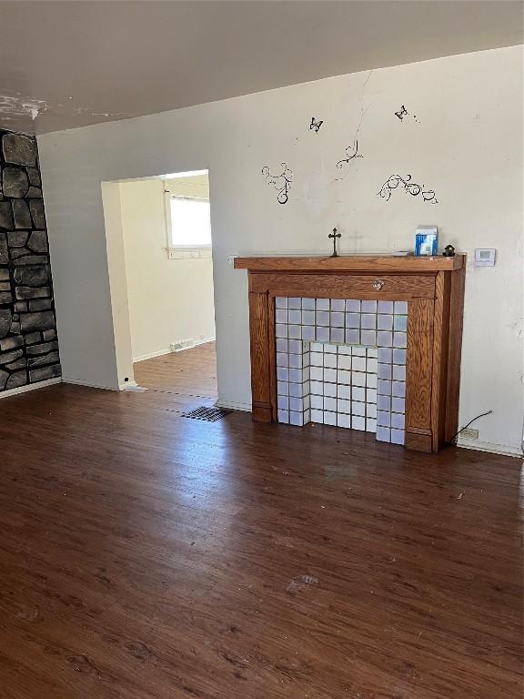 2627 Van Buren Ave, Erie, PA 16504 - unfurnished living room featuring wood finished floors and a fireplace