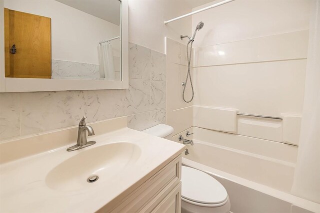 1303 Anna Ct, Erie, PA 16504 - bathroom featuring toilet, tile walls, shower / bath combo with shower curtain, and vanity