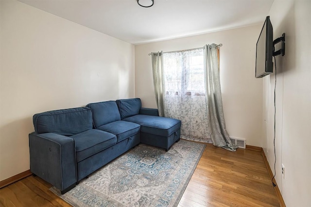 1303 Anna Ct, Erie, PA 16504 - living room featuring wood finished floors and baseboards