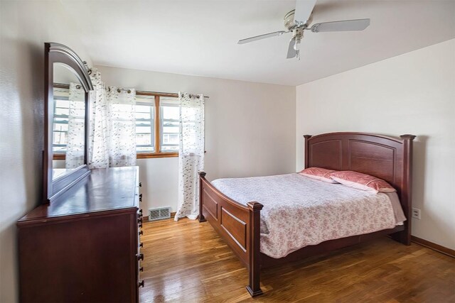 1303 Anna Ct, Erie, PA 16504 - bedroom featuring wood finished floors, a ceiling fan, and baseboards