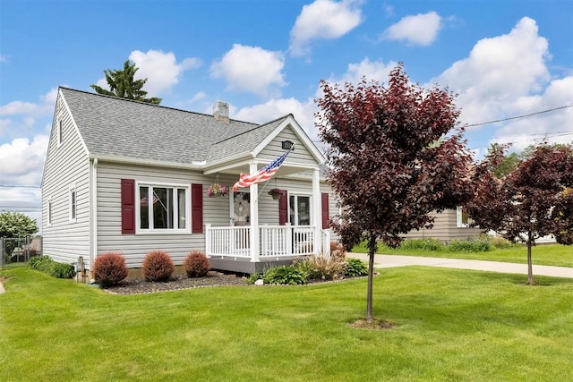 2514 E 43rd St, Erie, PA 16510 - view of front of house featuring covered porch, a shingled roof, a chimney, and a front lawn
