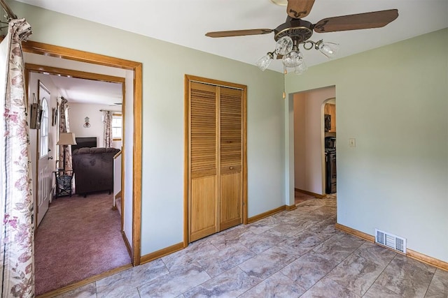 2514 E 43rd St, Erie, PA 16510 - bedroom featuring arched walkways, a closet, baseboards, and ceiling fan