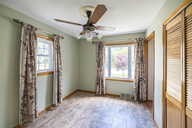 2514 E 43rd St, Erie, PA 16510 - unfurnished bedroom featuring baseboards, a closet, and a ceiling fan