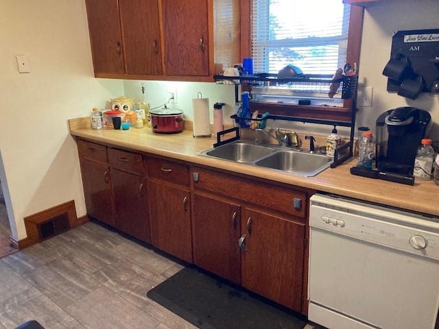 kitchen featuring dishwasher and sink