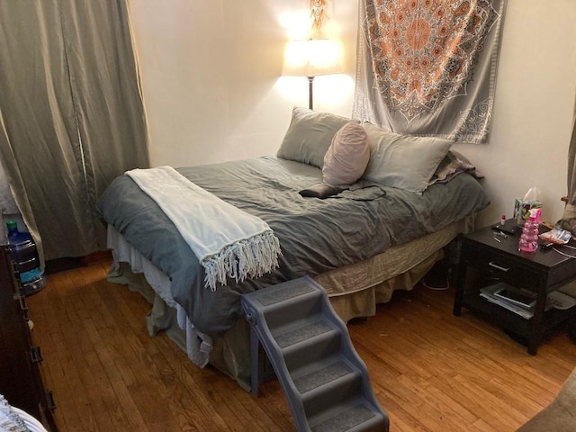 bedroom featuring hardwood / wood-style floors