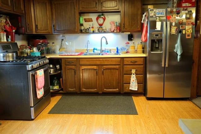 17315 Phelps Rd, Linesville, PA 16424 - kitchen with appliances with stainless steel finishes, light countertops, light wood-style floors, and open shelves