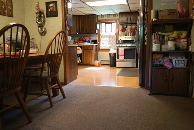 17315 Phelps Rd, Linesville, PA 16424 - kitchen with gas range, a paneled ceiling, light carpet, and light countertops