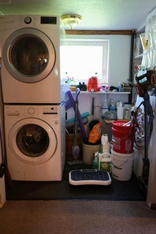 17315 Phelps Rd, Linesville, PA 16424 - washroom featuring stacked washer and clothes dryer and carpet flooring