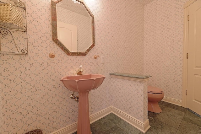 bathroom featuring tile patterned floors and toilet