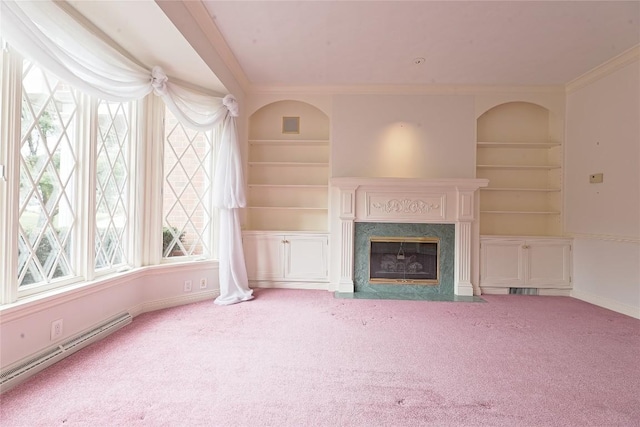 unfurnished living room with light carpet, ornamental molding, baseboard heating, built in features, and a fireplace