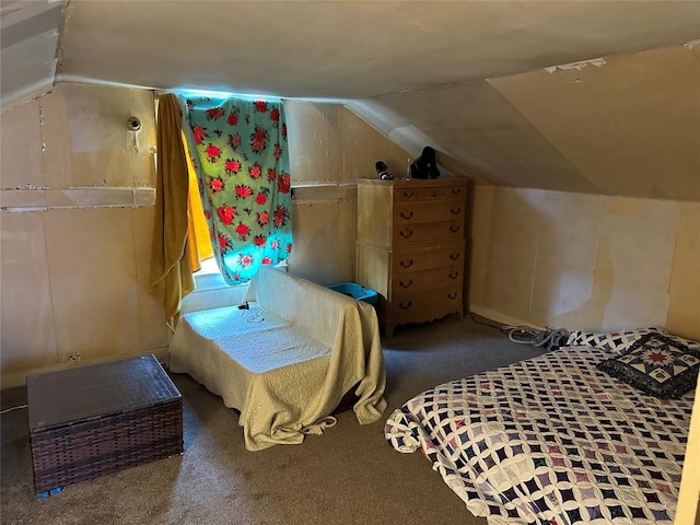 bedroom featuring lofted ceiling and carpet