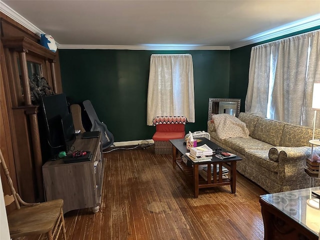 sitting room featuring dark wood-type flooring and crown molding