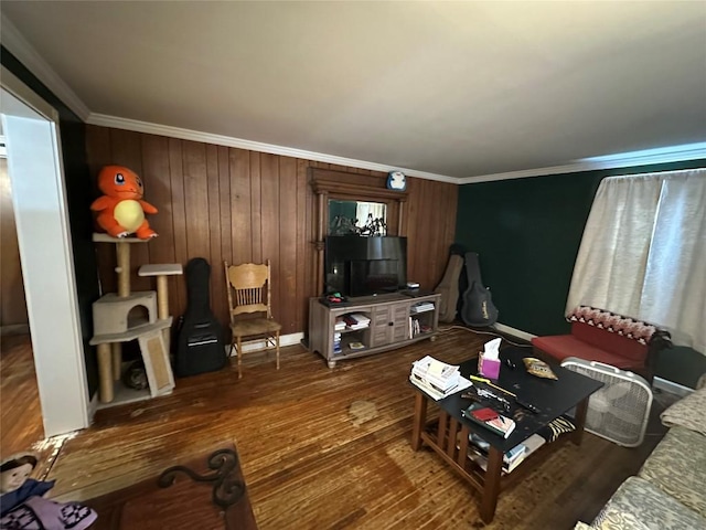 living room featuring ornamental molding and wood finished floors