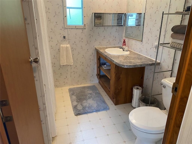 bathroom with vanity and toilet