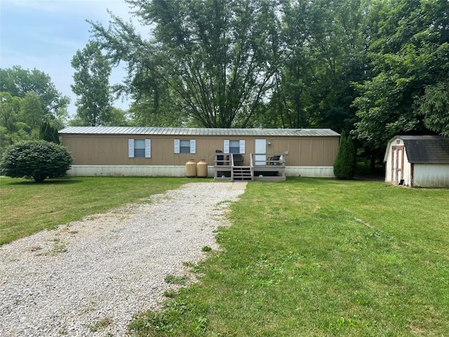 exterior space with a shed, a front lawn, and a deck